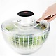 OXO Good Grips Salad Spinner with finger pressing brake button