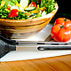 Bowl of salad next to microphone-shaped Sing Along Tongs
