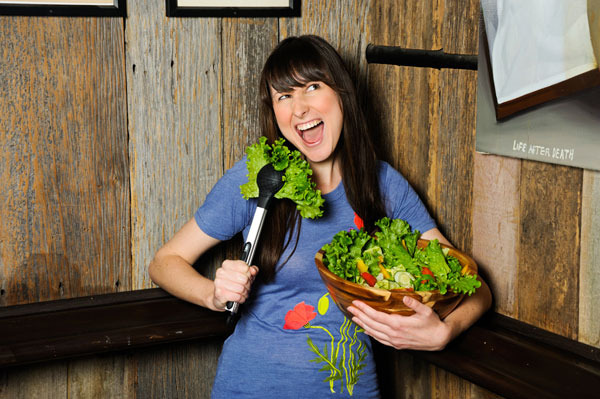 Girl with salad and Sing Along Tongs