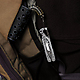 Leatherman 831207 Style CS Clip-On Multi-Tool with Scissors clipped on a bag