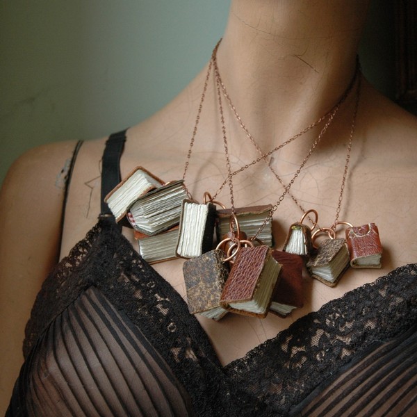 Several_black_spot_book_necklaces_on_mannequin-sixhundred
