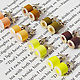 Color Pencil Stud Earrings by HuiYi Tan yellow set at an angle
