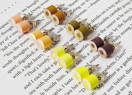 Color Pencil Stud Earrings by HuiYi Tan yellow set at an angle