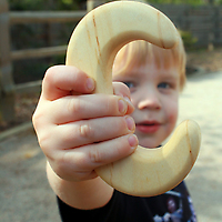 ABC Wooden Teether Rattle by Little Alouette C with boy 
