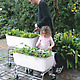 Tall FoodMap Container on patio with father and daughter