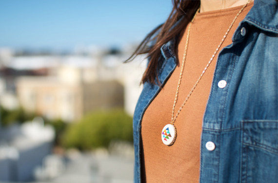 Golden_triangle_cross_stitched_pendant_necklace_by_gamma_folk_5-sixhundred
