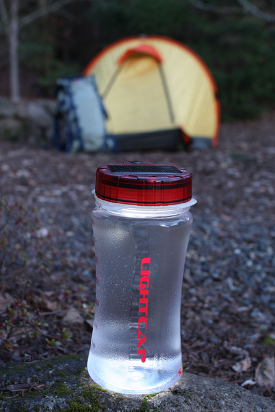 Lightcap_300_solar-powered_lantern_and_water_bottle_camping_at_dusk-sixhundred