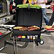 Margaritaville Tailgating Propane Grill with steak and corn on the cob