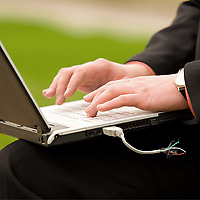 Fred Hacked USB Flash Drive attached to laptop with person using it