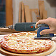 Fred Pizza Boss 3000 cutting through pizza