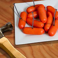 Fred Pound Nail Party Picks Set with hammer and plate of cocktail weiners