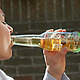 Women drinking beer with Fred Beer Band Drink Marker on the bottle