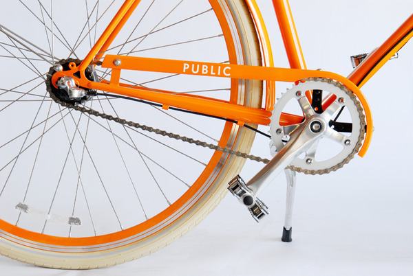 Public_orange_d3_bicycle_wheel_and_kickstand-sixhundred