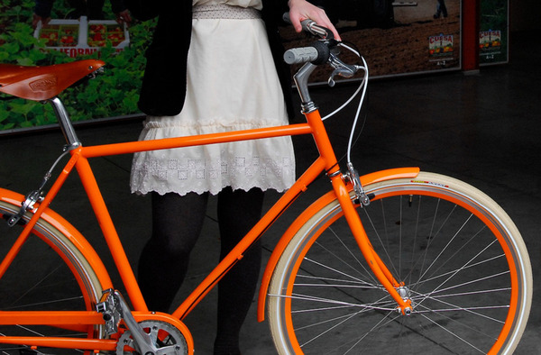 Public Orange D3 Bicycle with girl
