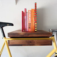 Knife &amp; Saw Bike Shelf walnut with books and yellow bike
